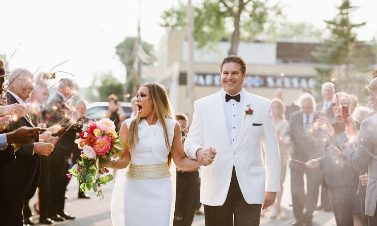 Jim Skrip and Vanessa Wilimas walking the aile in their wedding day